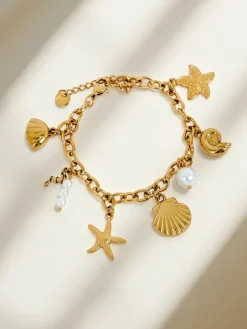 Bransoletka Aphrodite Maretta pozłacana z zawieszkami morskimi i perełką
