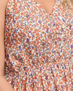 Pomarańczowa długa sukienka damska w kolorowe kwiatki - Odzież