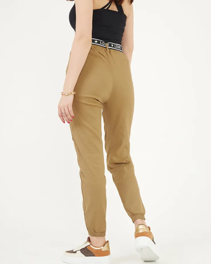 Royalfashion Beżowe damskie spodnie typu bojówki z kieszeniami