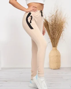 Royalfashion Beżowe damskie spodnie dresowe z czarnymi wstawkami