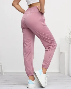 Royalfashion Ciemnoróżowe damskie spodnie dresowe typu joggery
