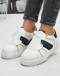 Royalfashion Czarno-białe damskie buty sportowe z gumowymi wstawkami Inika