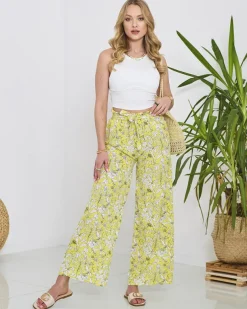 Royalfashion Damskie żółte spodnie typu palazzo z białymi kwiatami