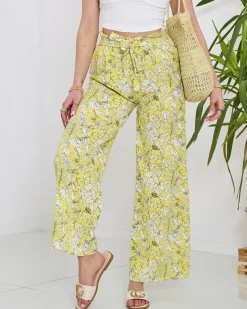 Royalfashion Damskie żółte spodnie typu palazzo z białymi kwiatami