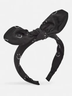 Royalfashion Dziecięca opaska do włosów z kokardką z printem w uśmiechnięte buźki