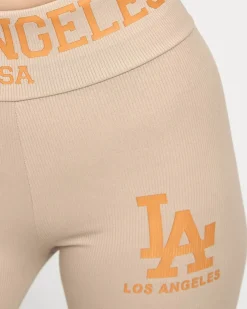 Royalfashion Jasnobrązowe damskie prążkowane legginsy z pomarańczowymi napisami