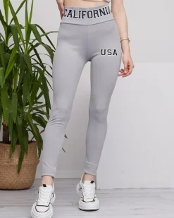 Royalfashion Jasnoszare damskie prążkowane legginsy z napisami