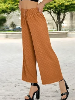 Royalfashion Szerokie spodnie damskie w kratę