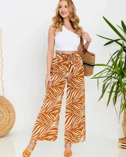 Royalfashion Wzorzyste spodnie damskie typu palazzo w kolorze camelowym