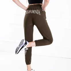 Royalfashion Zielone spodnie dresowe damskie z napisem
