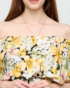 Żółta sukienka do kolana w różnobarwny kwiatowy wzór- Odzież